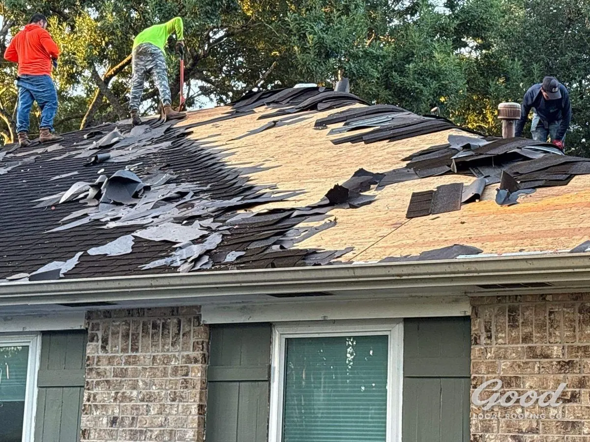 Good Local Roofing crew tearing off a roof on a Richmond home.