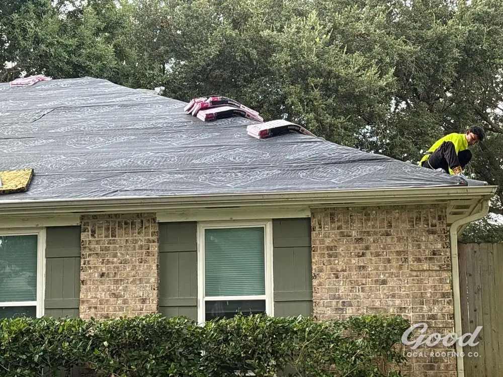 Residential roof fully dried in with underlayment, documented from the side elevation.